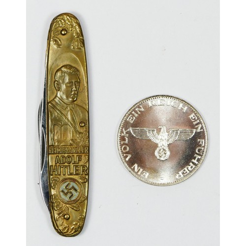 327 - A Drittes Reich Adolf Hitler penknife, the 65mm blade by Solingen, and a 1889-1945 Adolf Hitler coin... 