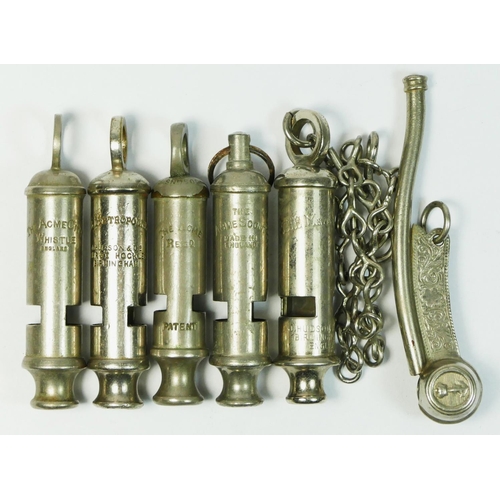 323 - Six vintage whistles, including a Naval Bosun's whistle.