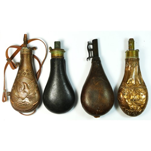 345 - A copper and brass powder flask, unsigned, embossed body, 20cm, two leather examples and a reproduct... 