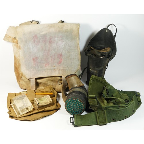 334 - A WWII civilian gas mask stamped Poppe Lot, size medium, with carry case, together with another simi... 