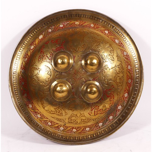 351 - Indo-Persian brass silver inlaid and red enamelled circular shield, with four central bosses and dec... 