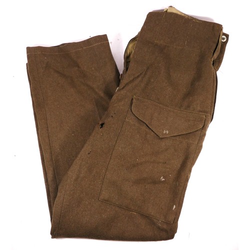 347 - A pair of Second World War Australian Battle dress trousers, signed 452 on internal waistband, toget... 