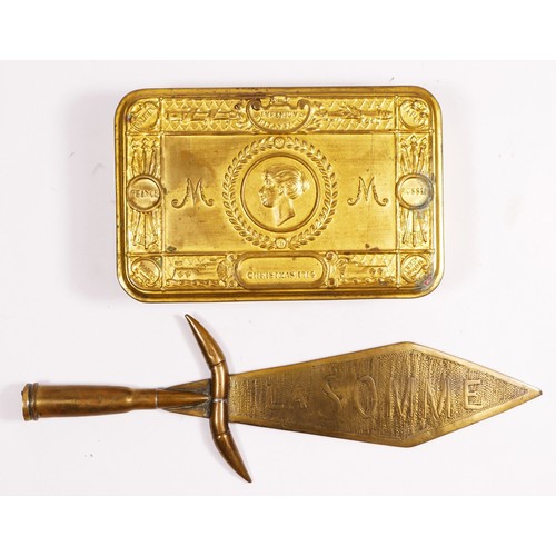 313 - A WWI Princess Mary brass Christmas box, 1914, together with a trench art dagger, the blade etched L... 