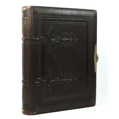 251 - A Victorian tooled Herborita photograph album, with printed floral designs, 30 x 23 x 6cm