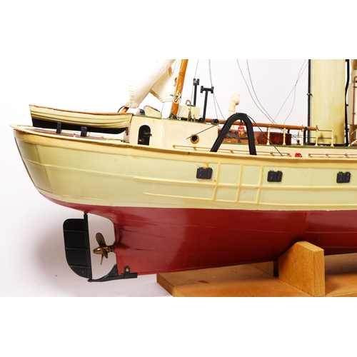 260 - A scale model of a fishing trawler, Whitby Star M 127, 88cm x 40cm, presented on a wooden base, buil... 