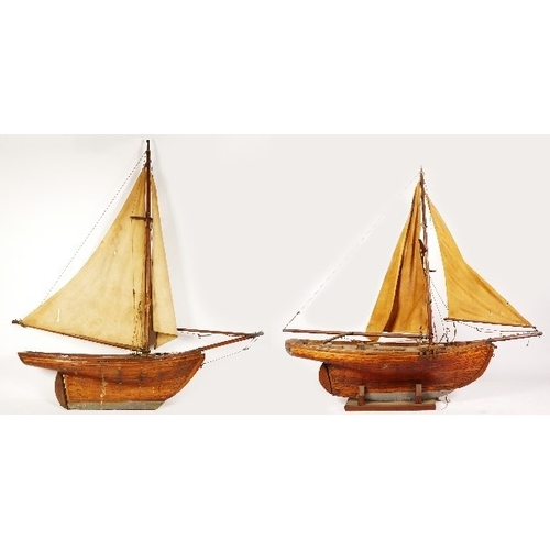 261 - Two model boats, wooden hull and masts, fabric sails, intended for decoration, 72cm x 82cm (largest)