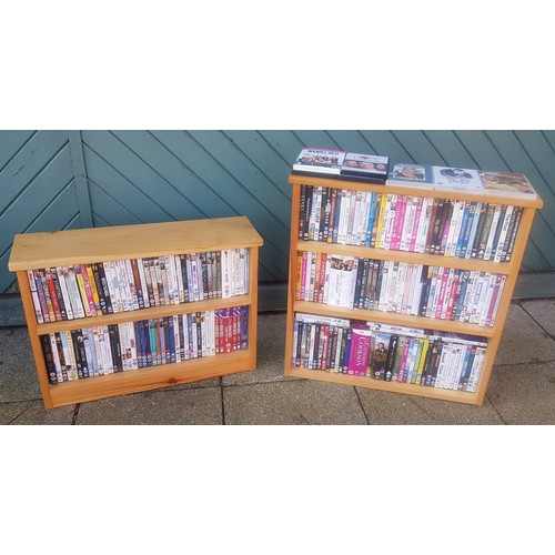 72 - A collection of DVD's, primarily films, over 200 titles, with display shelf units. (2)