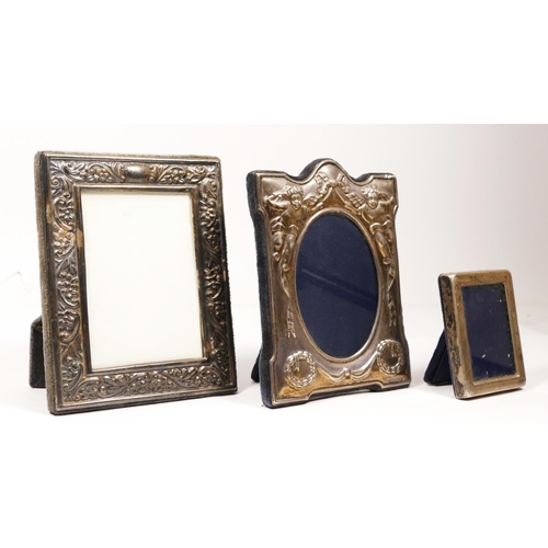 112 - Three silver photograph frames, with cherubs, Sheffield 1992, 13 x 10cm, another Sheffield 1991 and ... 