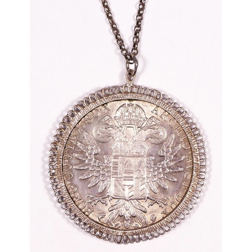 A silver pendant mounted with a Maria Theresia coin, 39.7gm