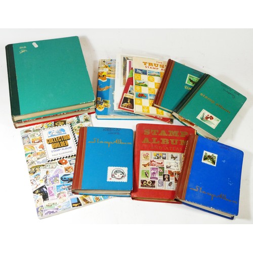 97 - A large collection of world stamps, loose and in albums with various unsorted stamps, primarily dati... 