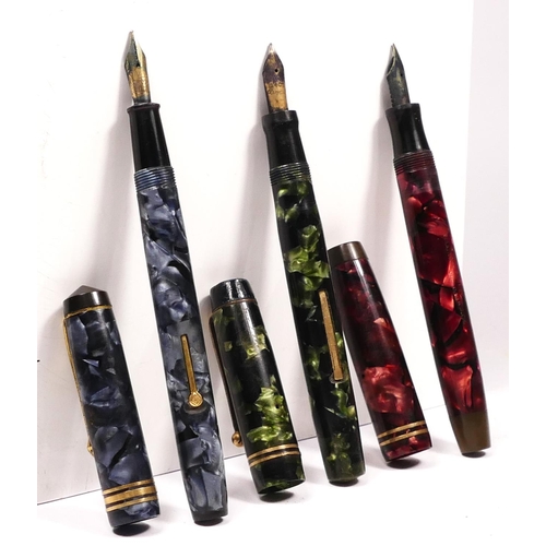 110 - A Parker Duofold red marbled fountain pen with 14K gold nib, a Conway Stewart 388 blue mottled fount... 
