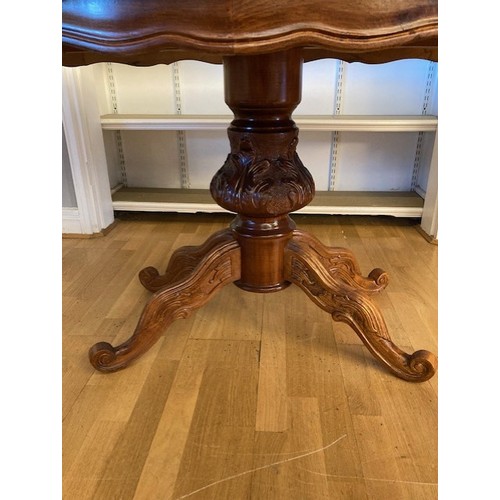 7 - An Italian Sorrento dining table, the top having inlaid walnut and marquetry floral effect pattern, ... 