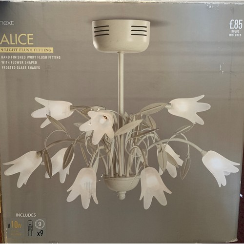 27 - A pendant ceiling light, consisting of nine floral shades