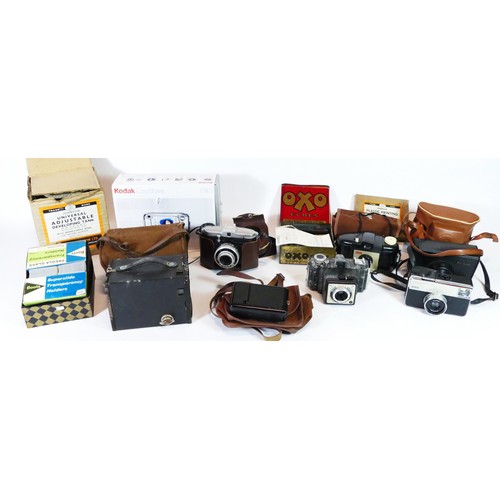 59 - A collection of vintage cameras and equipment to include a Kodak box Brownie, a Victor Coronet, a Fe... 