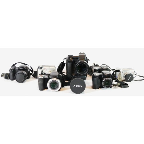 50 - Seven bridge cameras to include an Olympus E-Zop, a Kodak 27590, a Kodak DX6490, a Fujifilm 55000, a... 