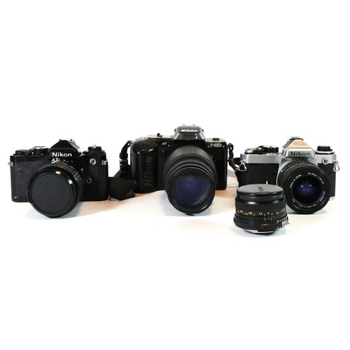 54 - Three Nikon film cameras to include a Nikon FE, a Nikon F-401s and a Nikon FE with lens, also includ... 