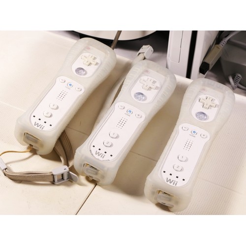 64 - A Nintendo Wii console, model No RVL-001 (serial No LEH200793306), together with power and AV cables... 