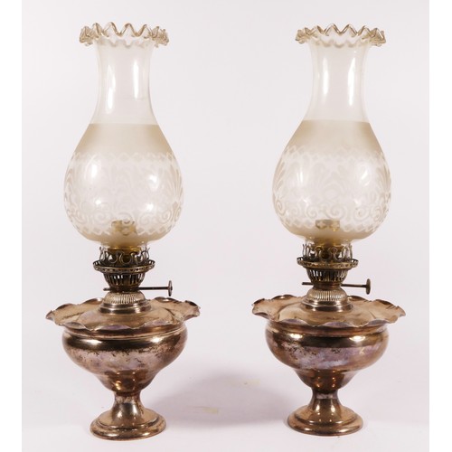 78 - A pair of silver plated oil lamps with frosted glass shades (converted to electric) 39cm tall. (2)