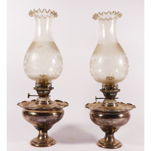 78 - A pair of silver plated oil lamps with frosted glass shades (converted to electric) 39cm tall. (2)
