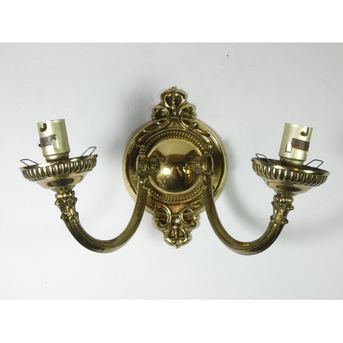 75 - A pair of cold cast chandelier, brassed, each consists of three arched arms holding a shade, togethe... 