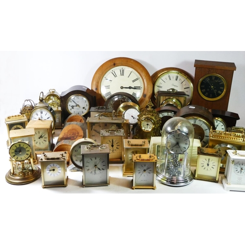 A collection of manual wind and quartz mantel clocks, to include ...