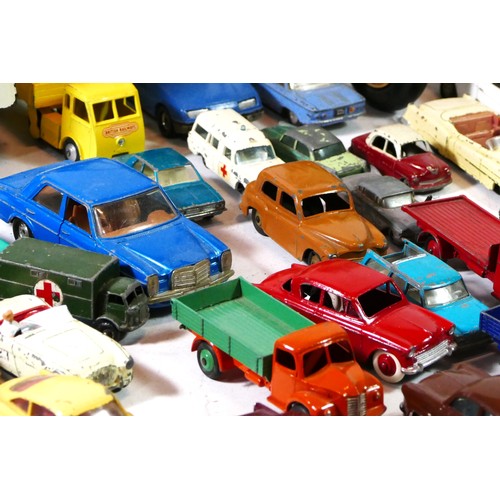 93 - A large collection of playworn diecast models makers to include - Corgi, Dinky, and Matchbox, togeth... 