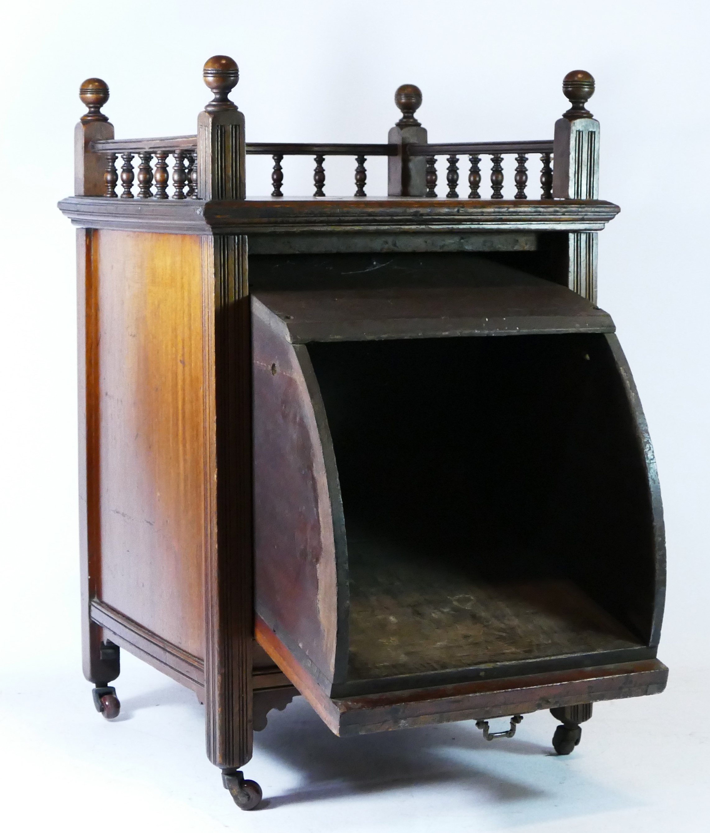 An Edwardian mahogany coal scuttle having turned carved gallery back ...