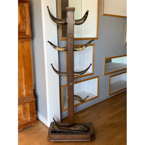 610 - A Victorian oak hall stand, with ten cow horn branches, terminating in a plated ball finial, with dr... 