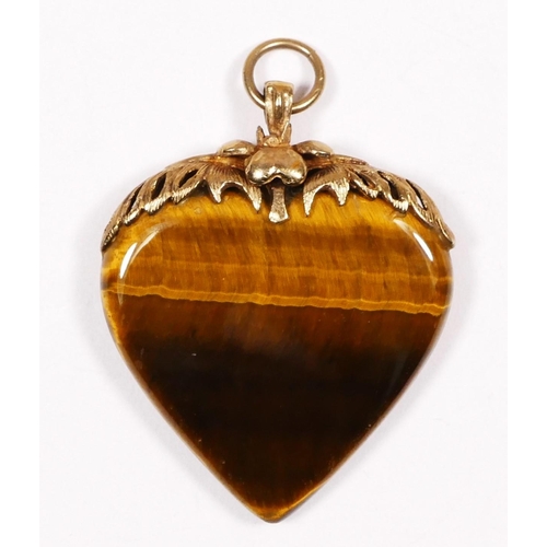 A 9ct gold mounted tigers eye heart shape pendant, 37 x 30mm.