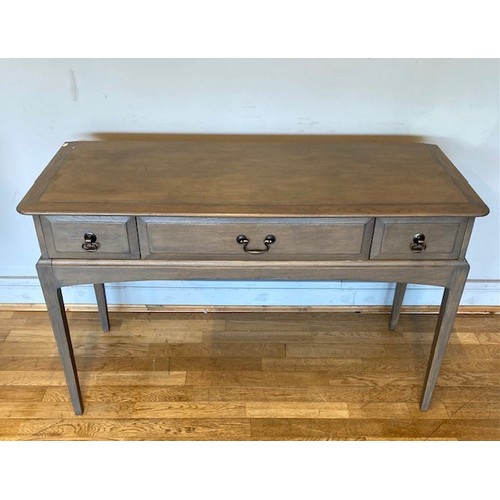 A modern Stag console/hall table, having central frieze drawer flanked ...