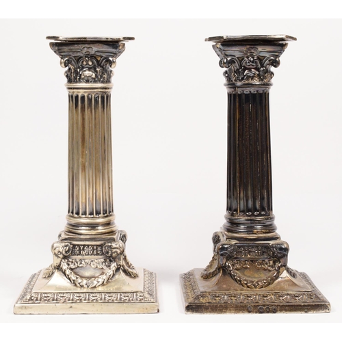 2 - A Victorian silver pair of corinthian column candlesticks, by Martin & Hall, London 1891, with rams ... 