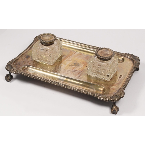 3 - A silver desk stand, London 1920, the base with two hob nail cut, silver topped inkwells and two pen... 