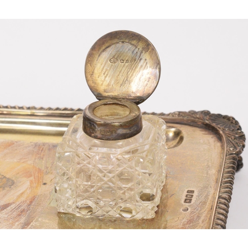 3 - A silver desk stand, London 1920, the base with two hob nail cut, silver topped inkwells and two pen... 