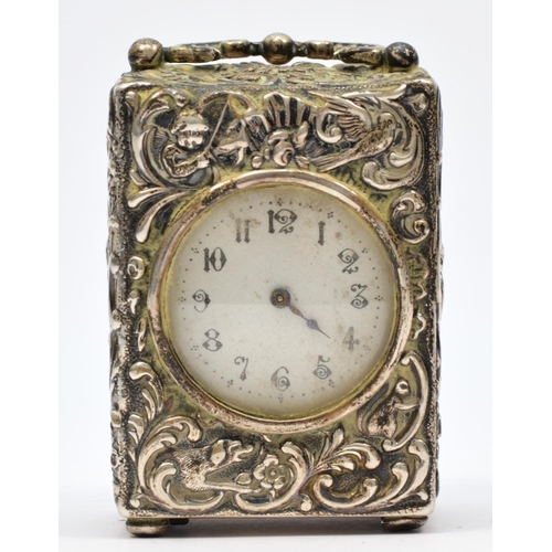 15 - A Victorian boudoir clock, London 1898, retailed by Goldsmiths and Silversmiths, white enamel dial w... 