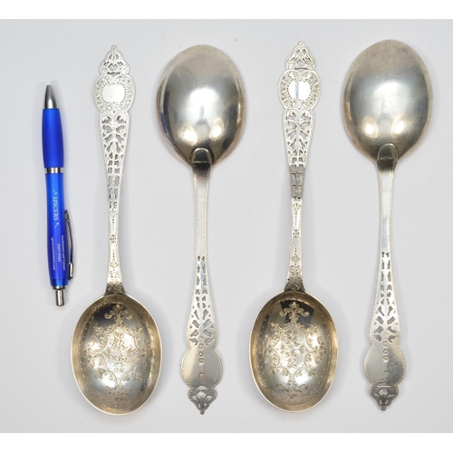 28 - A Victorian silver set of four fancy spoons, London 1853, with pierced and engraved decoration, 23cm... 