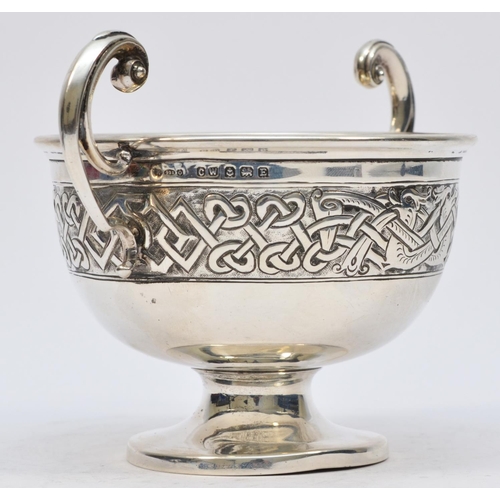 31 - A silver Celtic two handled bowl, by Charles Weale, Birmingham 1929, with Dublin import marks for 19... 