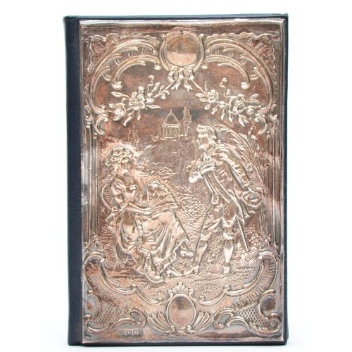 34 - A silver covered address book, London 1991, with embossed courting couple scene, unused, 12 x 8cm