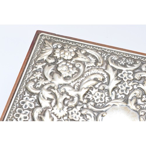 30 - A silver mounted jewellery box, Sheffield 1992, with embossed floral and scroll decoration, opening ... 