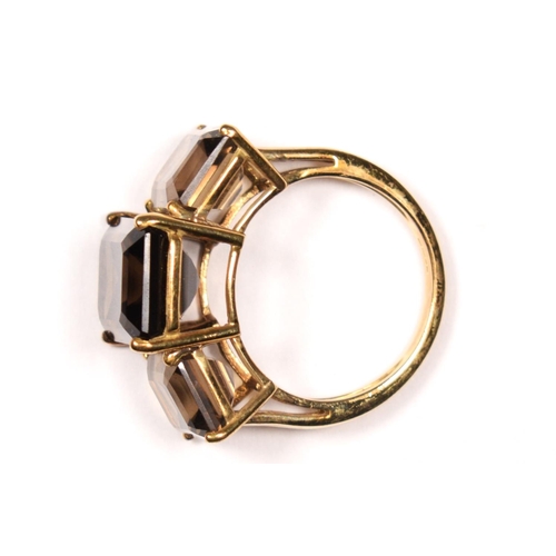 52 - A vintage 9ct gold and smokey quartz three stone ring, the largest 14 x 9mm, N, 6.4gm.