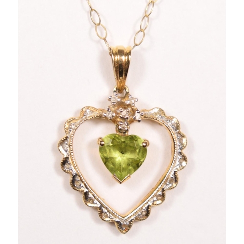 55 - A 14k gold peridot and diamond pendant, claw set with an articulated stone, 24 mm overall, 9ct gold ... 