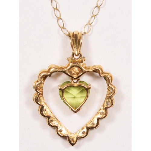 55 - A 14k gold peridot and diamond pendant, claw set with an articulated stone, 24 mm overall, 9ct gold ... 