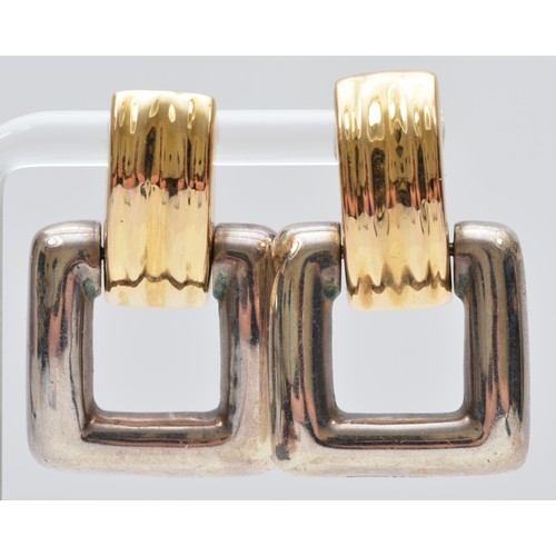 58 - Bayanihan, a 14K gold and silver pair of Modernist earrings, signed, 35 x 22mm, 11gm.
The Bayanihan ... 