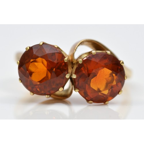 67 - A vintage 9ct gold and two stone citrine crossover ring, diameter 9mm each, R 1/2, 6.7gm