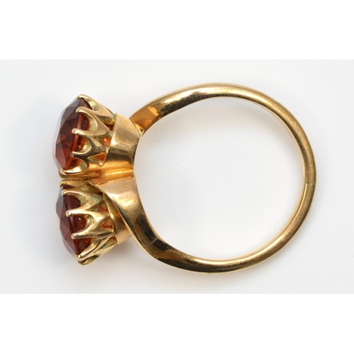 67 - A vintage 9ct gold and two stone citrine crossover ring, diameter 9mm each, R 1/2, 6.7gm