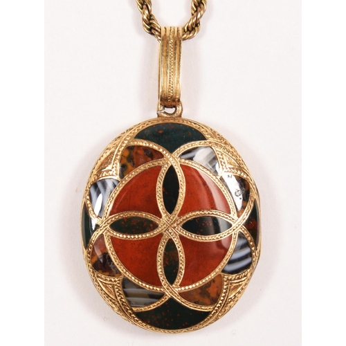 72 - A Victorian Scottish gold and pebble oval locket, the double sided geometric design set with various... 