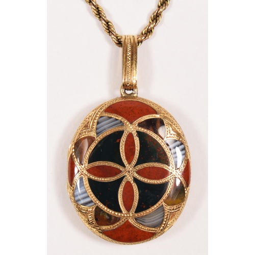 72 - A Victorian Scottish gold and pebble oval locket, the double sided geometric design set with various... 