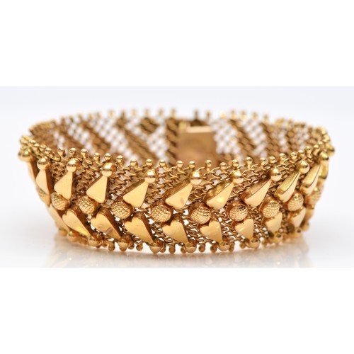 75 - An Italian 18ct gold woven bracelet, stamped 750, with applied decoration, 17.5cm, 33.1gm