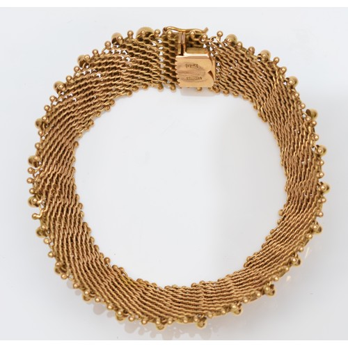 75 - An Italian 18ct gold woven bracelet, stamped 750, with applied decoration, 17.5cm, 33.1gm