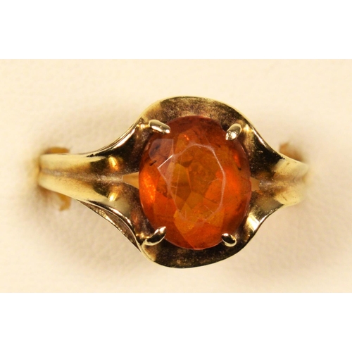 76 - A 585 gold (14ct) and citrine dress ring, wavy claw set with an oval mixed cut stone, 10 x 8mm, 3.5g... 