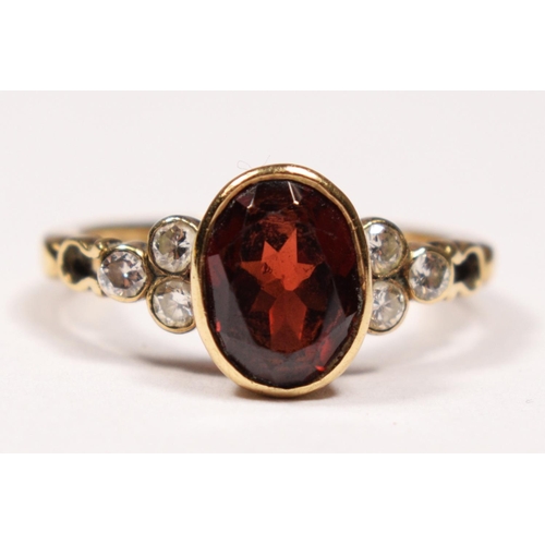 77 - A 9ct gold, garnet and brilliant cut diamond ring, collet set with an oval mixed cut stone, trefoil ... 